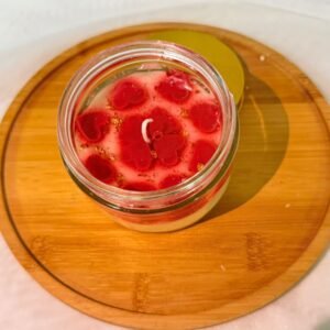 Vela con corazones flotantes